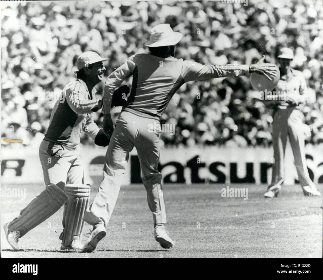 Feb. 26, 2012 - Howzat: Gregg Chappell, the Australian Captain, had a good grasp of on inflation, when he lunged to his right to take an easy catch of a wayward baloon - during the Australia-India one-day match in Sydney. His lightning reflexes delighted wicket keeper Rodney. Chappell handed it ti keeper Rodney Marsh who tucked it under his arms and strolled to the boundary to the delight of the players and spectators. Stock Photo