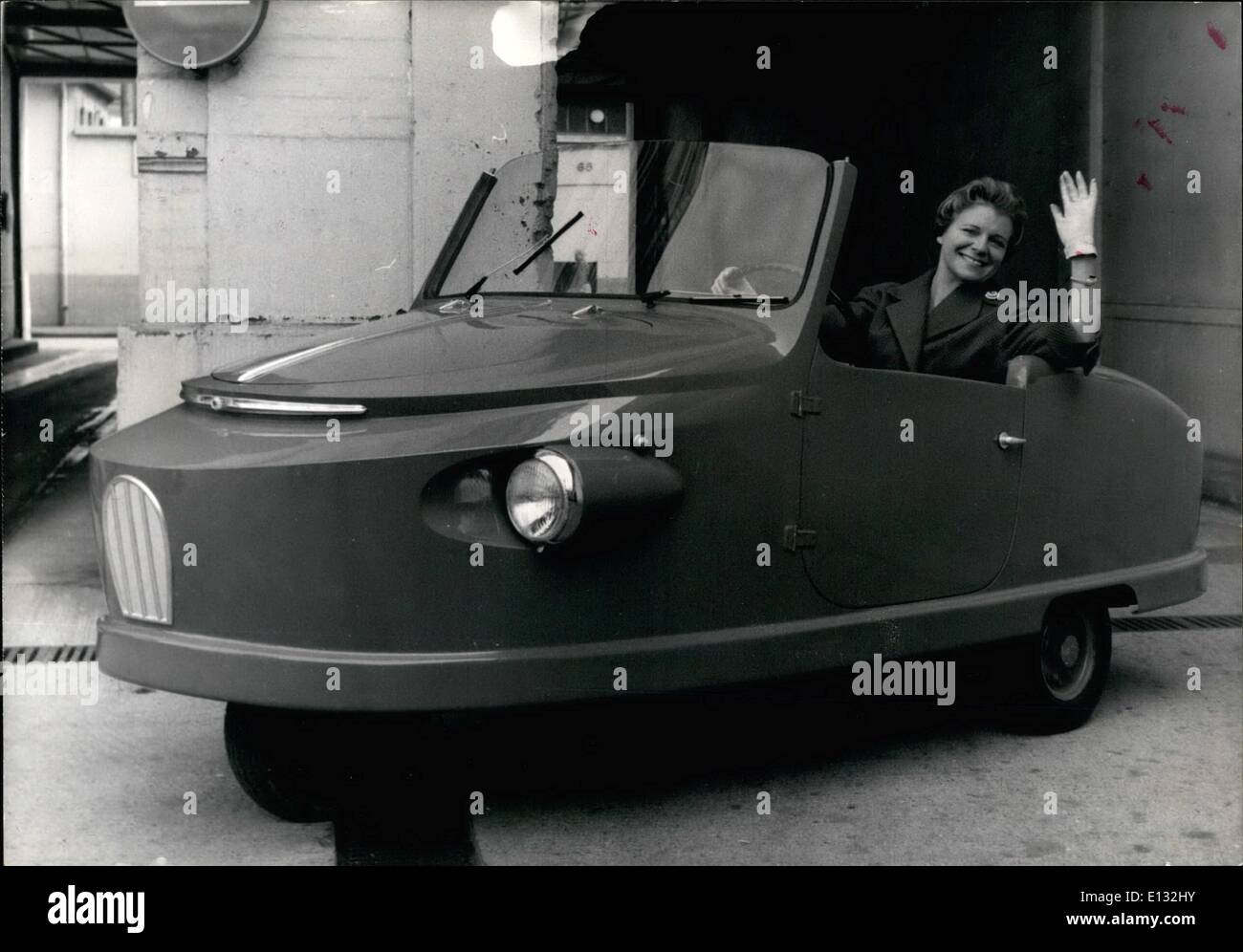 Feb. 26, 2012 - A new small economic vehicle in Paris. In 1956, Mr. Paul Villeple, automobile pioneer and former airplane pilot, began to study the formula of a small economic vehicule, that would be both robust, spacious and present absolute security; It would be intended essentially for those who, before buying a real automobile, are reluctant to become motobykers or scooterists. NPM: This three-wheels vehicle, of which the front wheel is a driving wheel as well as the directing wheel with a body in plastic, has a maximum speed of 65 km/per hour. It is equipped with a Snecma 125 CM3 motor. Stock Photo