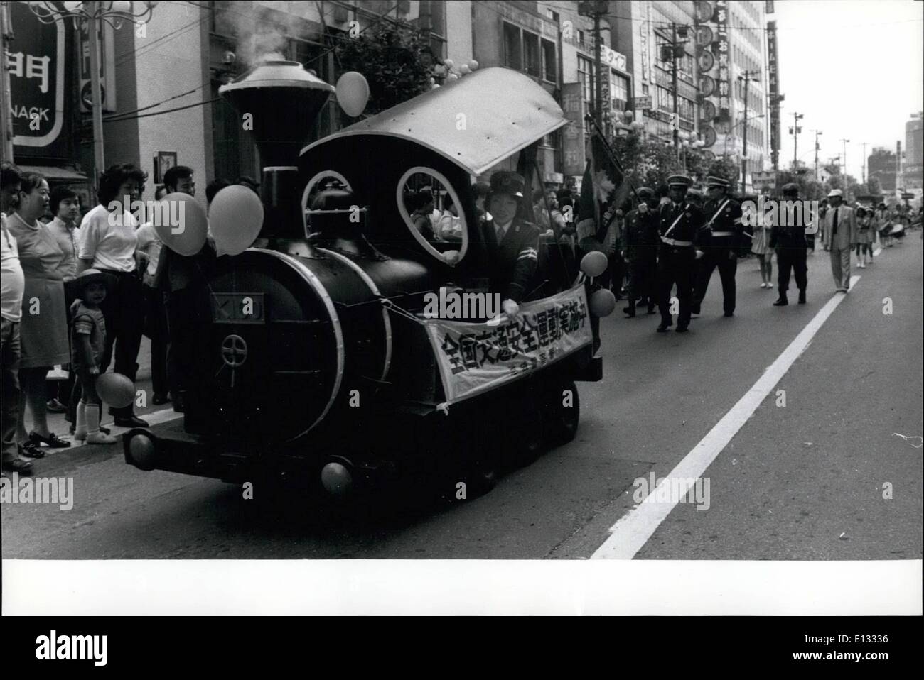 Feb. 26, 2012 - Old Style of Steam engine for the Traffic safety Campaign.: Driven by a policewoman, specially made steam engine goes through the busy street in Ikebukuro, downtown of Tokyo, showing the Traffic Safety Campaign. Stock Photo