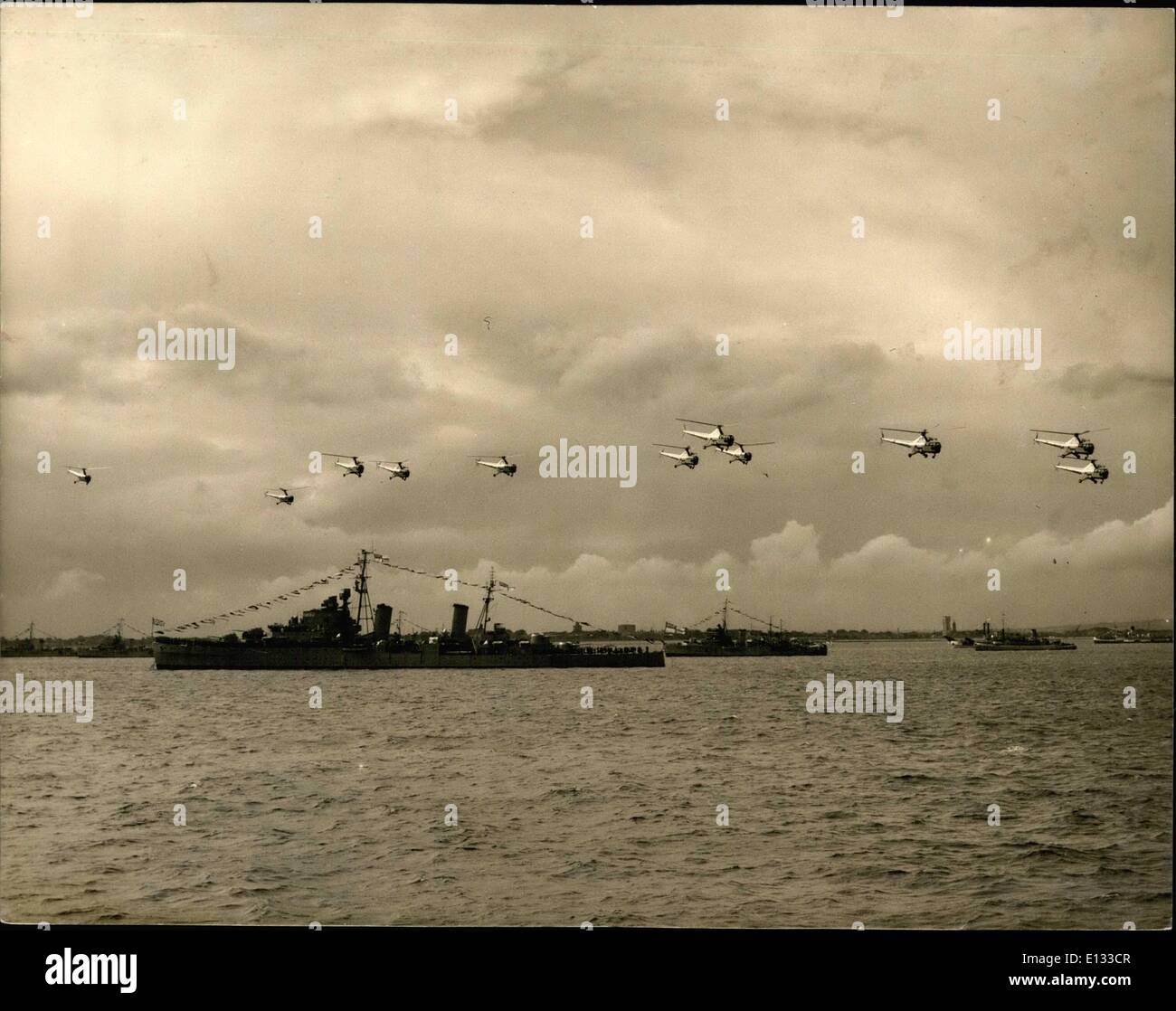 Feb. 26, 2012 - Hover planes Salute the Queen.The British Cruiser HMS Glasgow (9, 100 tons) Shows Hover planes flying in Formation during the flypast salute made by 300 Naval Planes at the 300 Warship Coronation Naval Review at Spithead today. Stock Photo