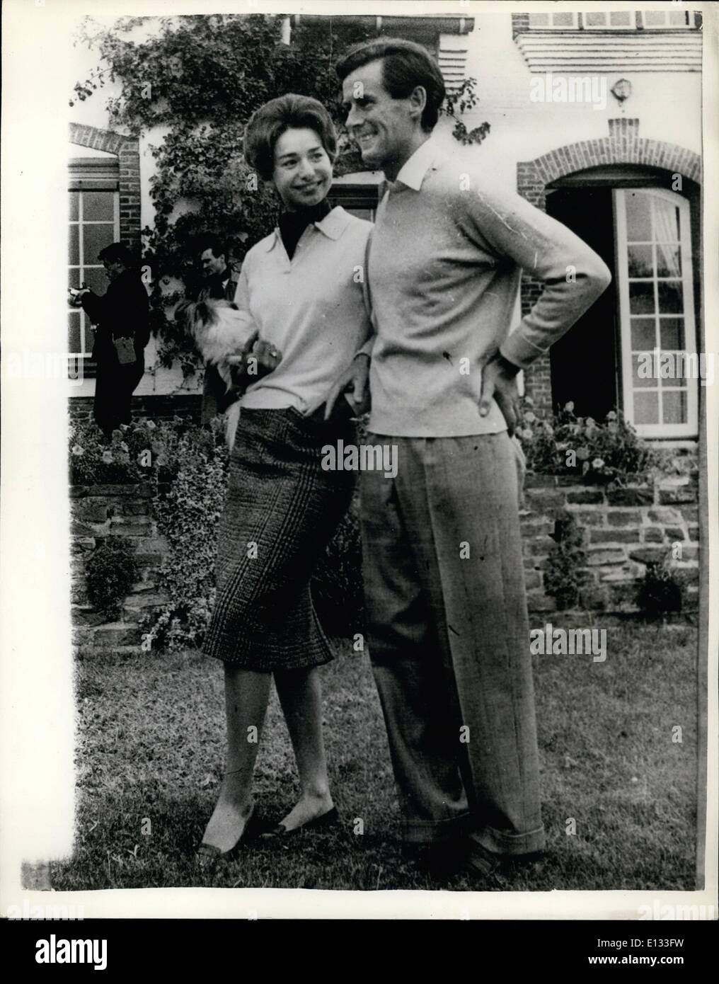 Feb. 26, 2012 - Group Captain Peter Townsend To Marry His Secretary: The engagement has been officially announced of Group Captain Peter Townsend former suitor Princess Margaret - and 20 year old Marie-Luce Jamagne daughter of a wealthy Belgian cigarette manufacturer. Photo Shows Peter Townsend and Marie Luce Jamagne at the latter's home near Antwerp today. Stock Photo