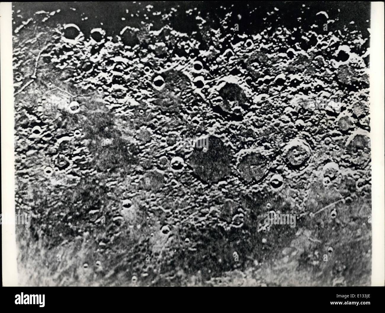 Feb. 26, 2012 - In the early November, The Russian scientist, Dr Kozyrov made successful observations on the moon's relief by means of the 50 inch iced alterations in the illumination of the ''Alphonsus'' crater. On obtaining spectroscopic photographs of the crater, he came to the conclusion that Volcano eruption had occurred in the moon. The scientist Continues to study the obtained data, in order to determine chemical composition of the emitted gases and to clear up the physical aspect of the phenomen. Photo shows Dr. Kozyrev's photograph of the moonsurface. Stock Photo
