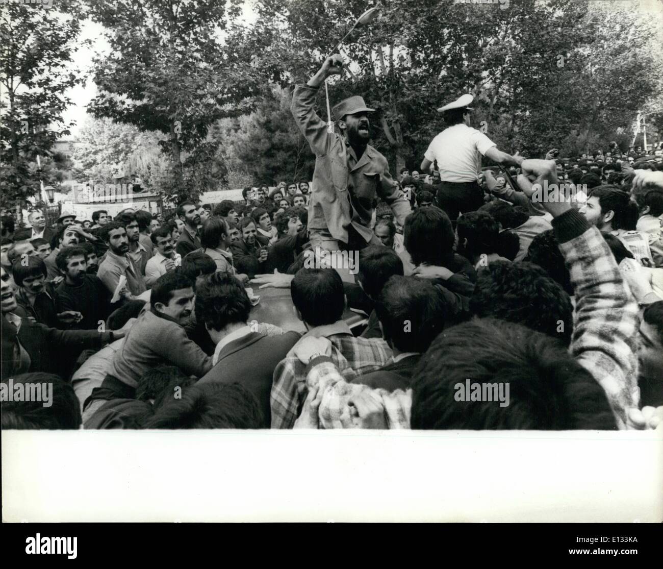 Feb. 26, 2012 - Scenes Outside Occupied U.S.Embassy In Tehran These dramatic pictures were taken around the U.S. Embassy in Tehran during the continuing imprisonment of staff by militant Iranian students. The students demonstrate their stand against President Carter and the Shah by burning the U.S. flag, displaying their weapons and waving unflattering portraits of their enemies. Also evident is their religious fervour and support for the Ayatollah Khomeini. Stock Photo