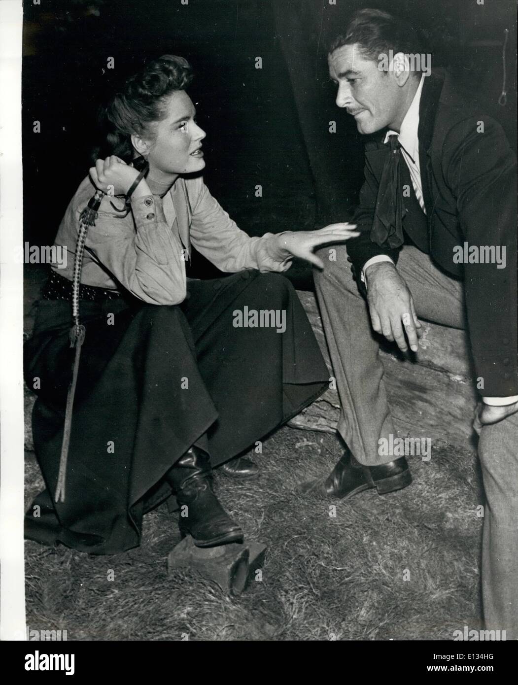 Feb. 28, 2012 - Errol Flynn Discusses His Forth Coming Marries With Star Alexis Smith: Alexis Smith and Errol Flynn seen as they have a quiet chat between scenes - in their Hollywood studios... Flynn is discussing his forthcoming marriage with Roumanian Princess Ghika.. He was recently divorced from Mora Eddington. Stock Photo