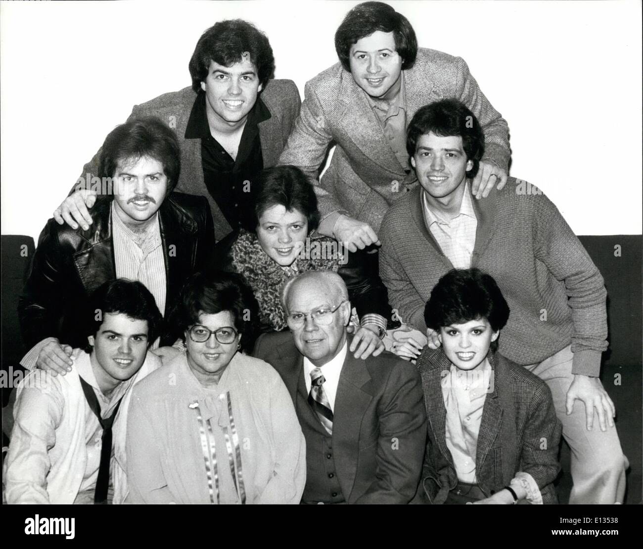 Feb. 26, 2012 - The Osmonds come to England. Back in England for the first time since 1975 are the famous family of pop. They will play four concerts in all, the highlight of their visit being a special charity show at the Albert Hall, which will be attended by HRH Princess Margaret. The proceeds from the concert will go towards the Horder centre for Arthritics and the Sunshine homes and schools for blind children. The Osmonds visitifollows a petition signed by more than 30,000 British fans. Photo Shows The entire Osmond family. Front row (1 to R) Donny, aproud Mr and Mrs Osmond , and Marie Stock Photo