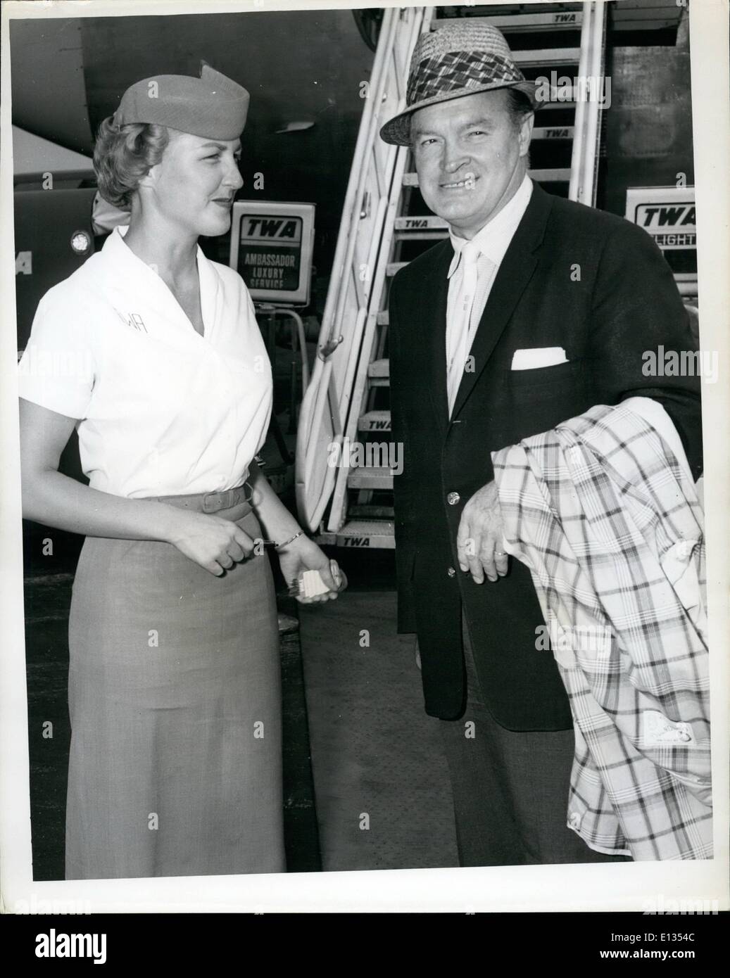 Feb. 26, 2012 - N.Y. International Airport, July 29 - Popular Comedian, Bob Hope Is Greeted By TWA Hostess Lucille Linciewicz Before Boarding A TWA Jetliner To Los Angeles, Where He Will Be On Hand To Celebrate His Daughter's Birthday. Hope Has Been In Town For 3 Days Following His 3 Week Visit In Europe Where He Helped Publicize His Movie ''Alias Jesse James' Stock Photo