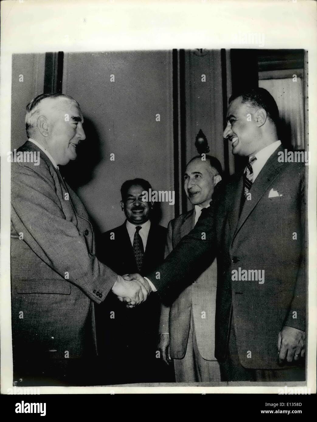 Feb. 28, 2012 - Mr. Menzies meets President Nasser of Cairo; Mr. Menzies and the four members of his Suez committee and their first meeting with President Nasser in Cairo today. Photo Shows Mr. Menzies (left) shakes hands with Colonel Nasser at the opening of the Suez talks in Cairo today. Between them is Wing Commander Aly Sabry (left) and the Egyptian Foreign Minister, Mahmud Franzy. Stock Photo