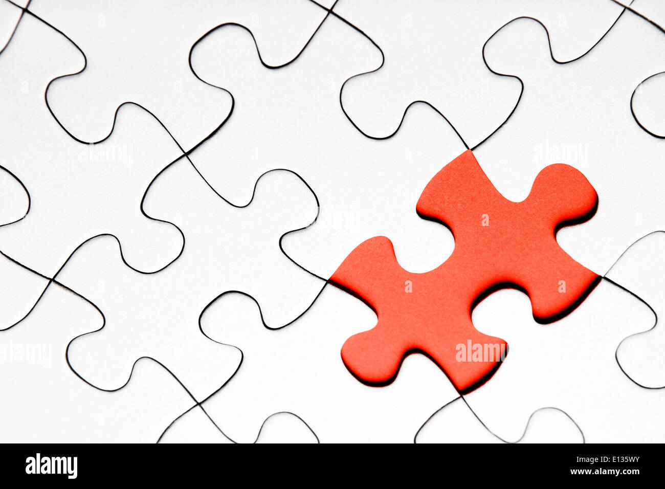 Red puzzle piece on white background Stock Photo - Alamy