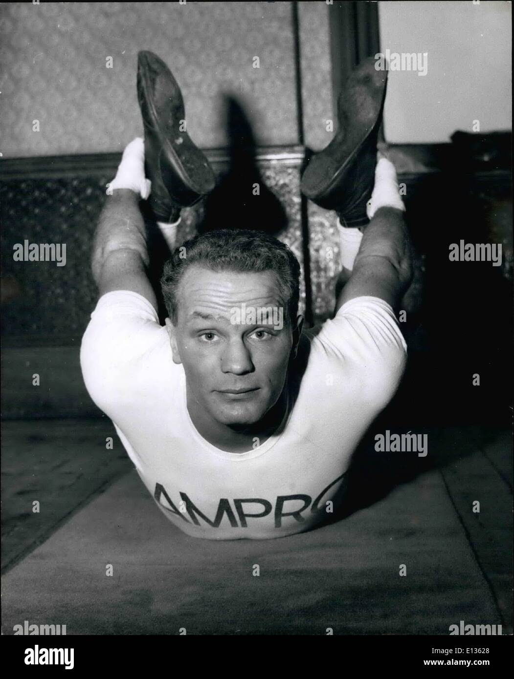 Feb. 28, 2012 - Henry Cooper performs a variety of toughening exercises in the gym where he is training from his fight with Brian London. Stock Photo