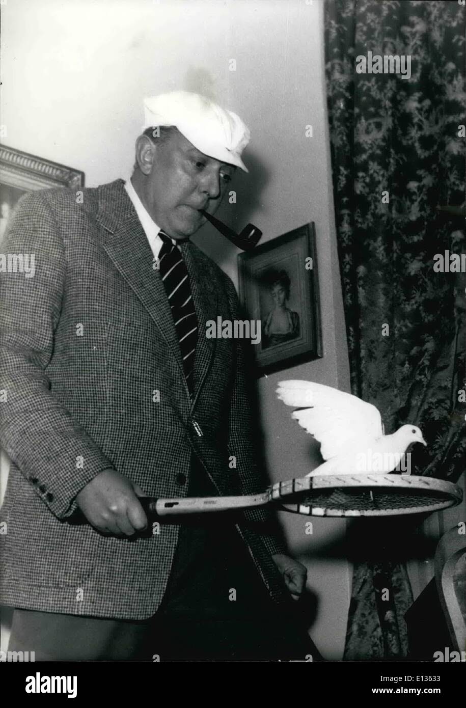 Feb. 28, 2012 - Tennis racket and dove to celebrate film producer's success. Jacques Tati, producer of the film Les Vacanes de M. Hulot (M. Hulot goes on holiday) has donned M. Hulot's white cap and brandishes a tennis racket on which the white dove (of Lassere's restaurant) seems quite at ease. Jacques Tati was awarded the Prix Louis-Delluc by a jury of cinema writers and reporters for his film during a luncheon held at Lassere's. Dec. 12/53 Stock Photo