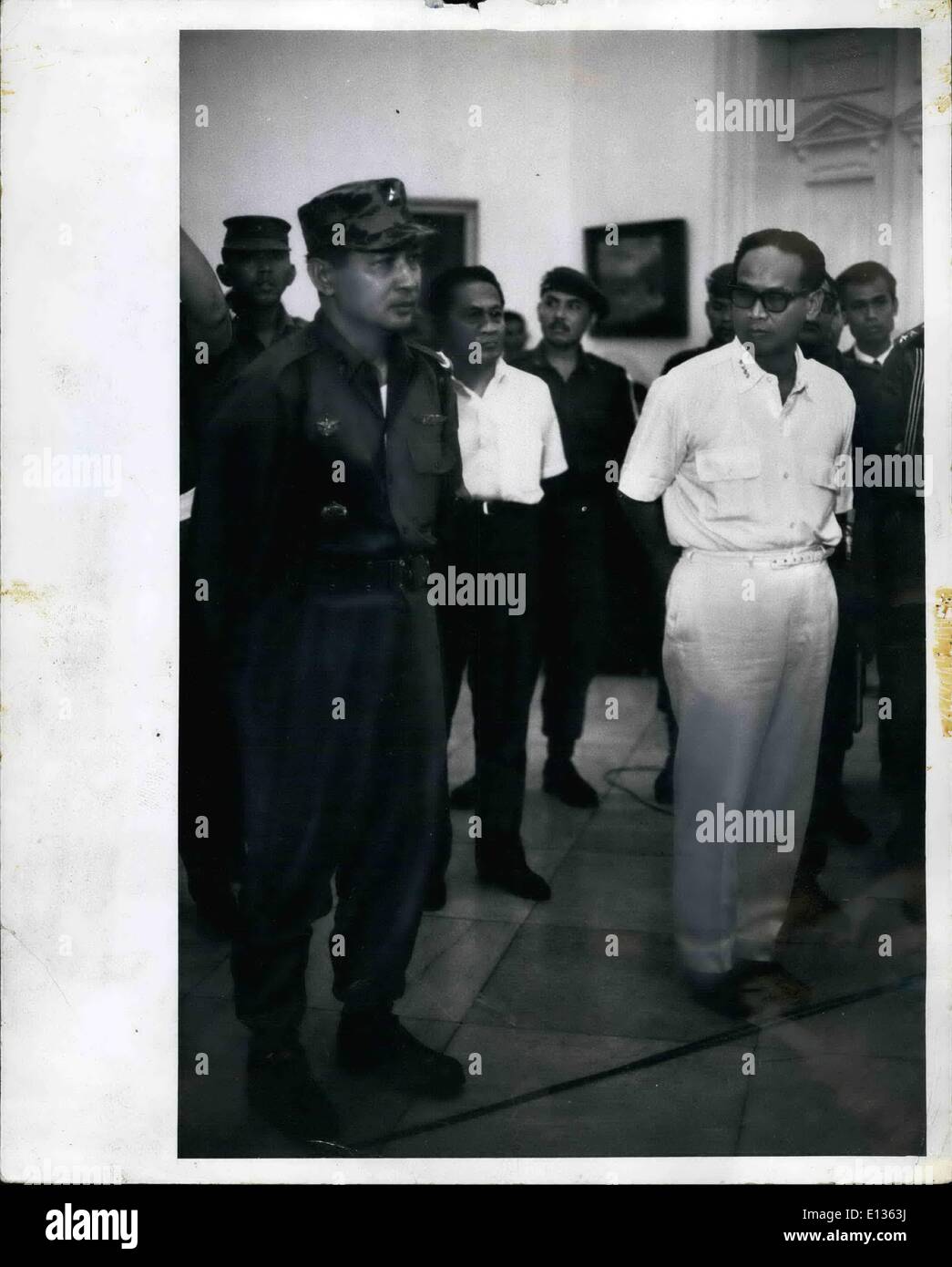 Feb. 28, 2012 - Maj. Gen Suharto (left in army uniform) at Istana Palace, Djakarta Indonesia, Oct. 14, 1965 when President Sukarno appointed him Army Chief of Staff. Suharto replaces Lt. gen Achmad yani, who was killed by the communists during the Oct. 1 aborted coup. In white, at right, is Dr. Subandario, 1st Deputy, Minister. An historic picture showing the two antagonists together (may be for the last time) with Suhato showing calm and resolution, while Subandario shows distrust and insecurity. Stock Photo