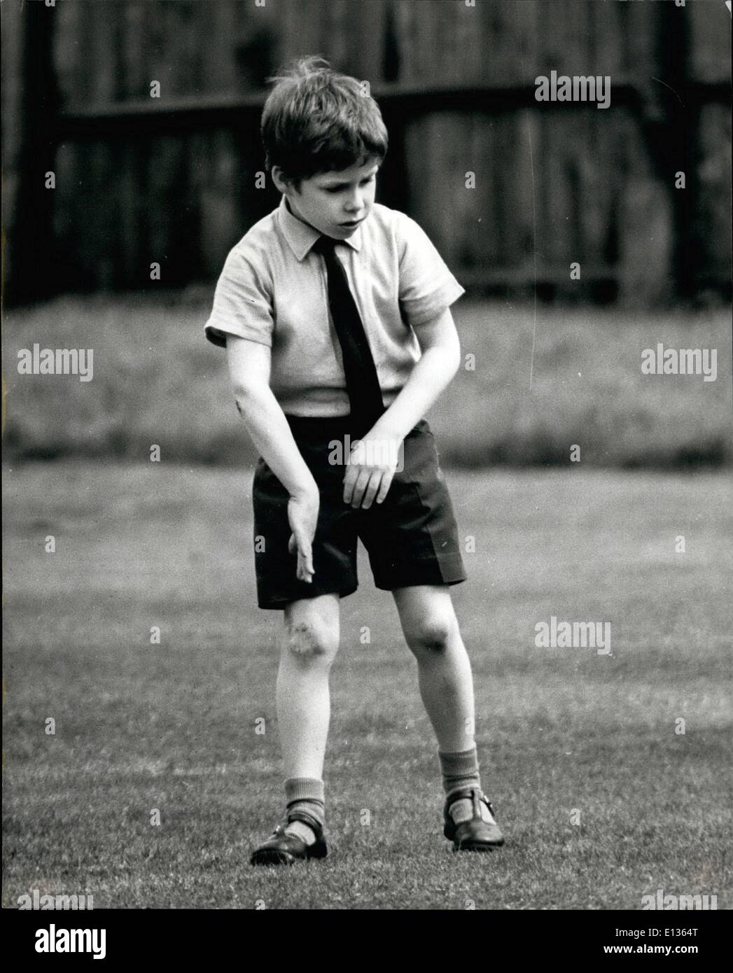 Feb. 28, 2012 - It seems as though 7 years old Viscount Linley is doing a cricket aims specially for the photographer. Son of Princess Margaret and Earl of Snowdon. Stock Photo