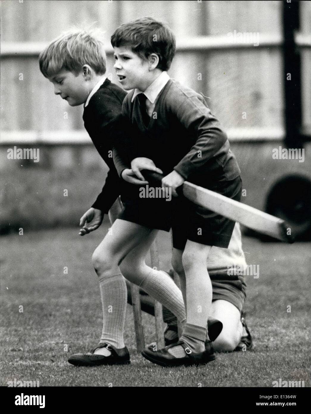 Feb. 28, 2012 - Some slightly unroyal behaviour from 7 year old Viscount Linley (right) as he tries to prevent one of his classmates getting the cricket bat. Son of Princess Margaret and Earl of Snowdon. Stock Photo
