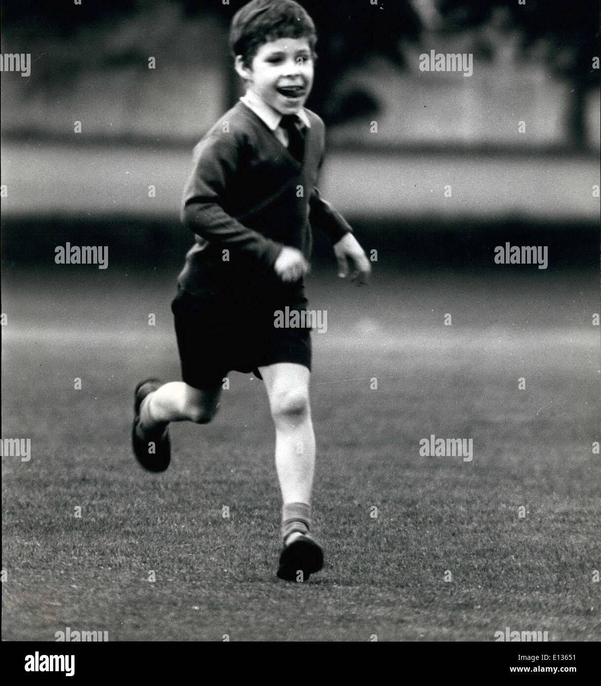 Feb. 28, 2012 - Like any little boy enjoying a game of cricket, 7 year old Viscount Linley runs to retrieve the ball. Son of Princess Margaret and the Earl of Snowdon. Stock Photo