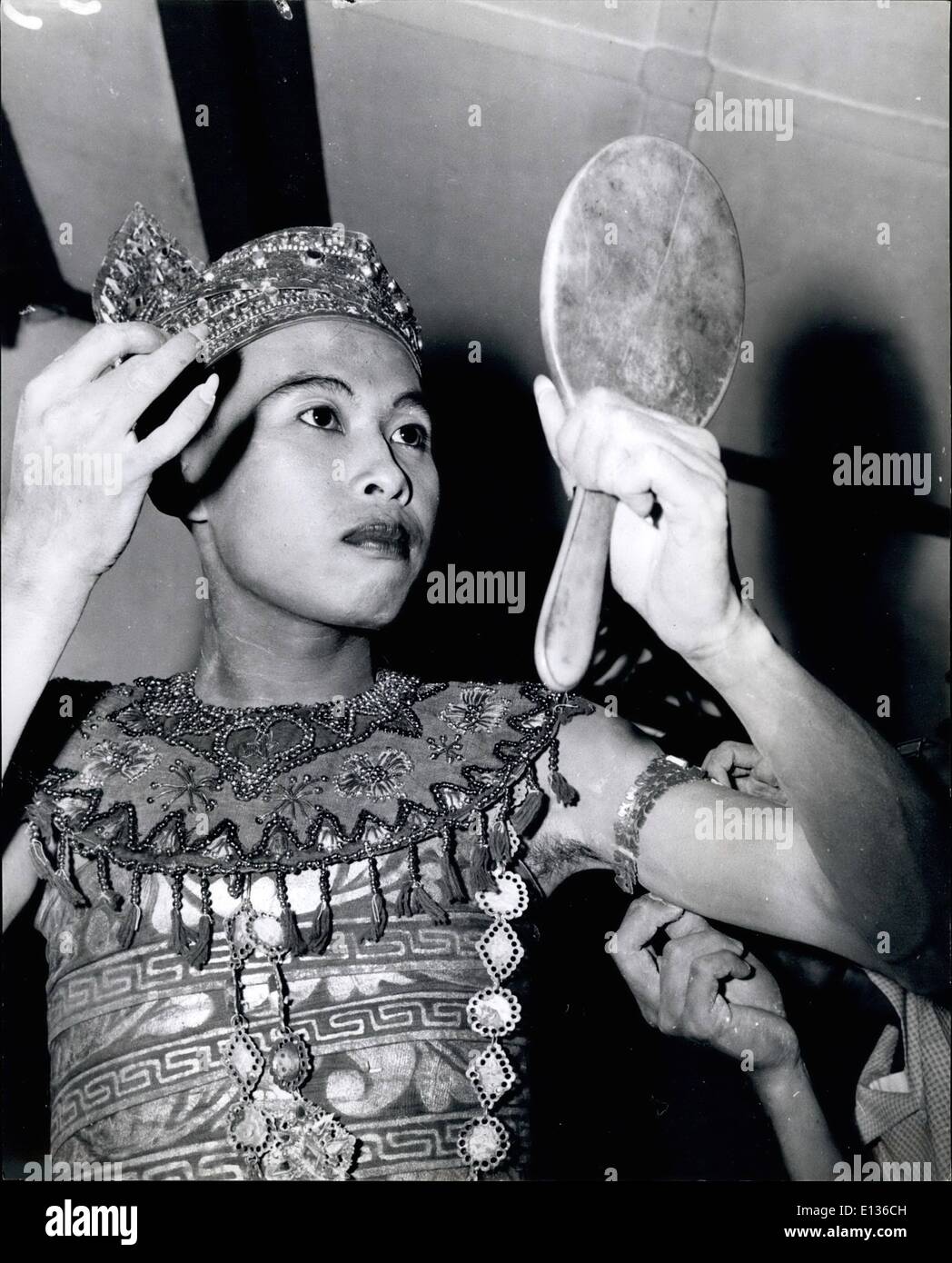 Feb. 28, 2012 - A male dancer of Java: Suripto, one of the best dancers of Java and now a teacher of Prince Sorjo's school, dresses for a performance in Balinese costume. It, and the jewelry belong to the Sultan's treasure. Stock Photo