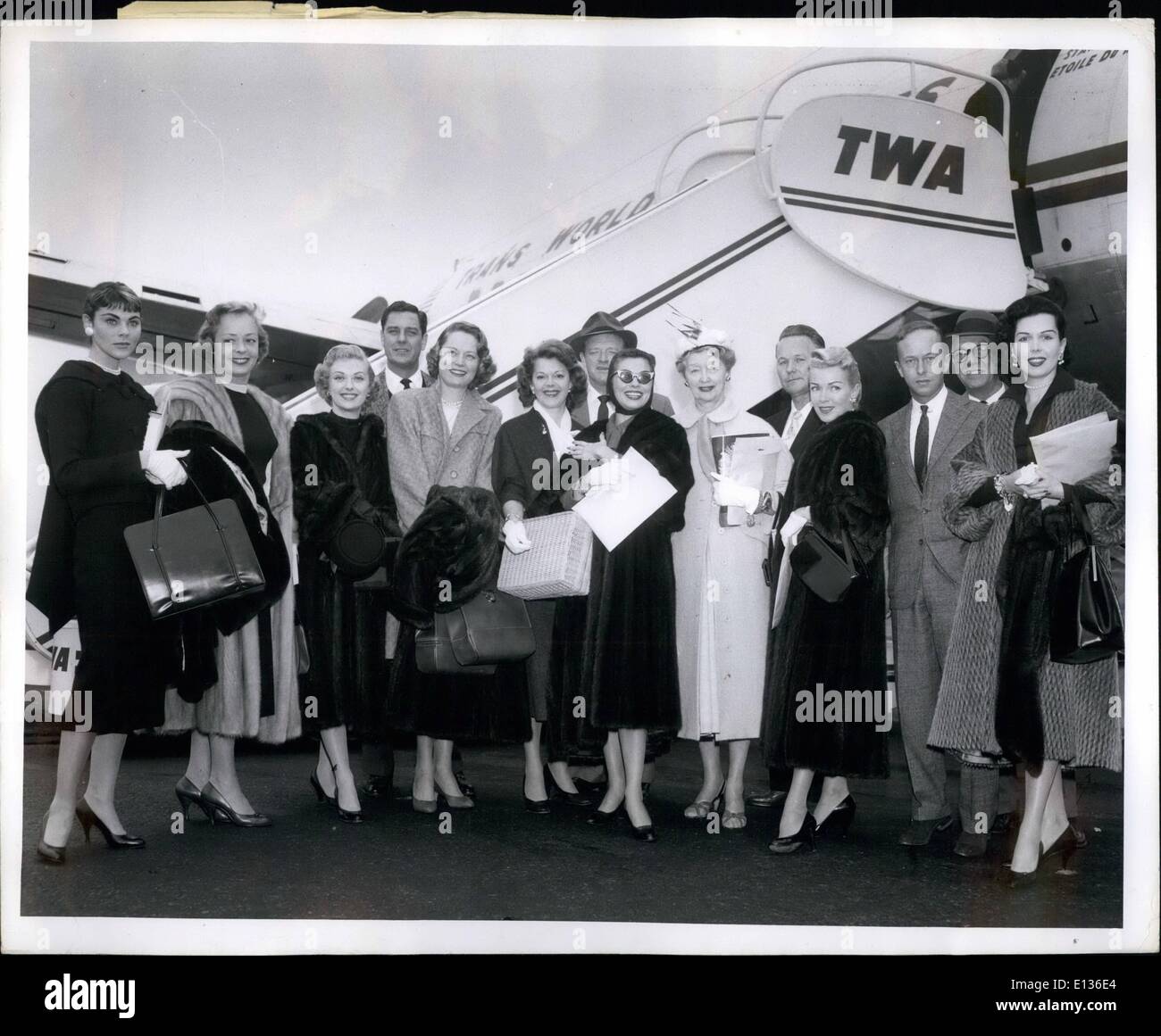 Feb. 28, 2012 - Los Angeles Airport, Calif Feb 26 -- the Hollywood contingent to the Uruguayan ILM Festival is shown before boarding a TWA Flight here today for New York Girls, (Left to right) AFE: Joanne Gilbert, Virginia, Elmore, Beverly Tyler, Alexis Smith, Mrs.Van Heflin, Joanne Del, Hedda Hopper, Lana Turner and Ann Miller. Between Miss Turner and Miss Miller is Paul De Smandek, Brazilian Consul, who has three to see the group's departure. The movie people will also in visit Brazil and Argentina.Anita Ekberg, who was also aboard the flight, is not in the picture. Stock Photo