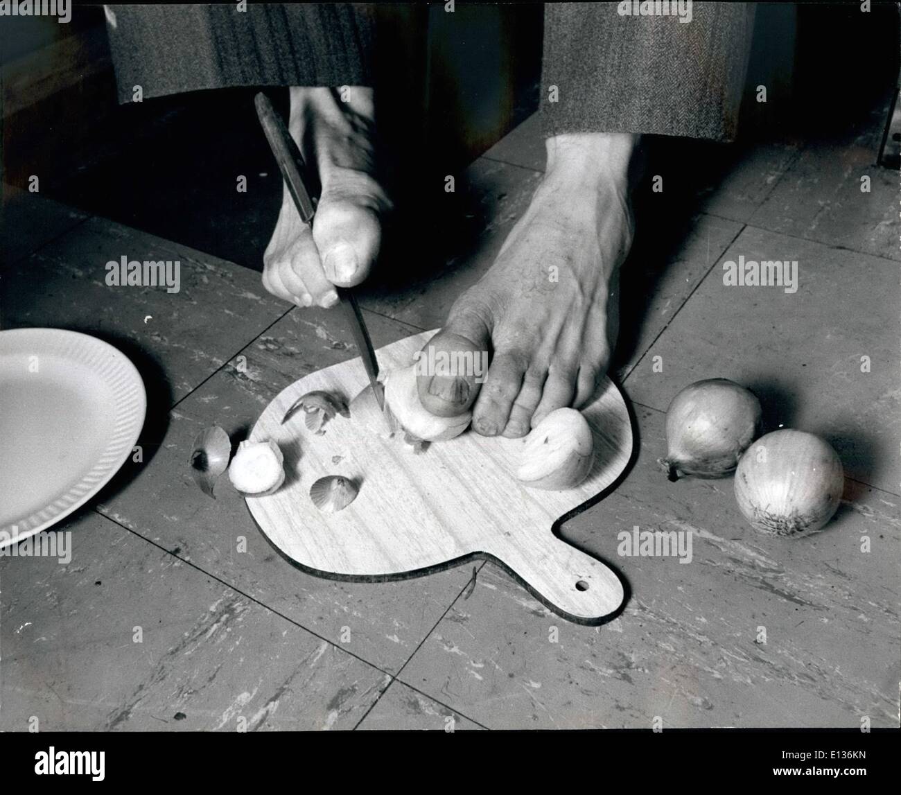 Feb. 28, 2012 - Frank Latch Prepares Onions for his evening meal. Stock Photo
