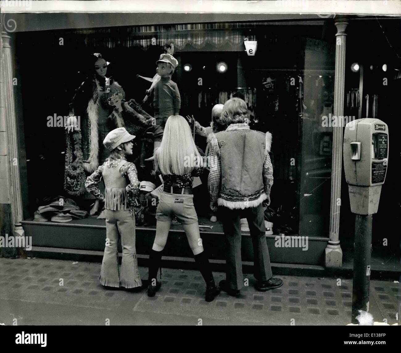 Feb. 29, 2012 - A trendy trio go shopping in Carnaby Street; L to R - Nicholas 8 years wearing a cap and a fringed suede cowbo Stock Photo