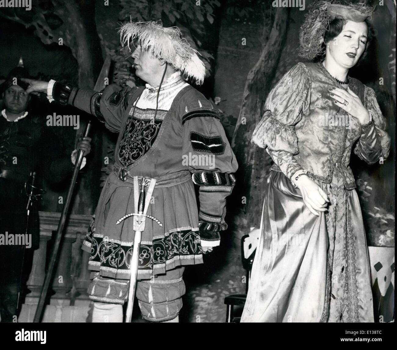 Feb. 29, 2012 - Shocked by the gipsy's prophecy, the Count-Palatine, with expressive gestures orders the gipsy to leave the Court, while his daughter sobs and cries. DEAF MUTES PERFORM STAGE PLAY IN VIENNA. Deaf mutes in Vienna have proved beyond doubt that it is not necessary to be able to speak and to hear to be an actor, in fact the ability to convey meaning a mine and gestures and to get the meaning over to the audience, is proof of an actor's capabilities. The play ''The Gipsy's Revenge'' was a 15th Century dramatic love story and was produced and written by a deaf mute Stock Photo