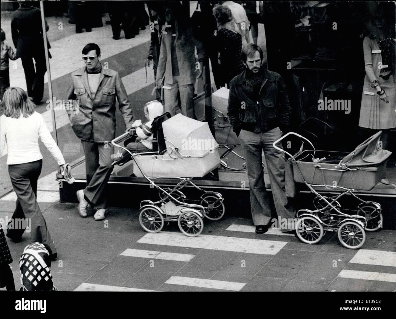 Feb. 29, 2012 - Equal Rights: begin here with the children! For these two fathers who look after their children while the mothers are shopping at the stores, it might be a matter of course, but still many man consider the raising and guarding of the children as the woman's task only. Those, who pass by these patient fathers with a pitiful smile, thinking ''This could not happen to me'', one just can tell-That remains to be seen! Stock Photo