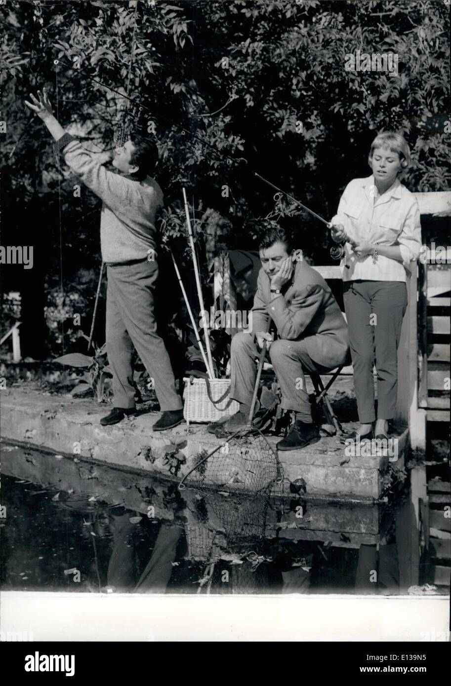 Feb. 29, 2012 - SCREEN STARS GO ANGLING DANIEL GELIN, FRANCOIS PERIER AND GENEVIEVE CLUNY (FROM LEFT TO RIGHT) ANGLING IN A SCENE OF THE FILM ''BONJOUR MONSIEUR MASURE'' NOW IN THE MAKING. THE FILM IS DIRECTED BY CLAUDE MAGNTER. Stock Photo