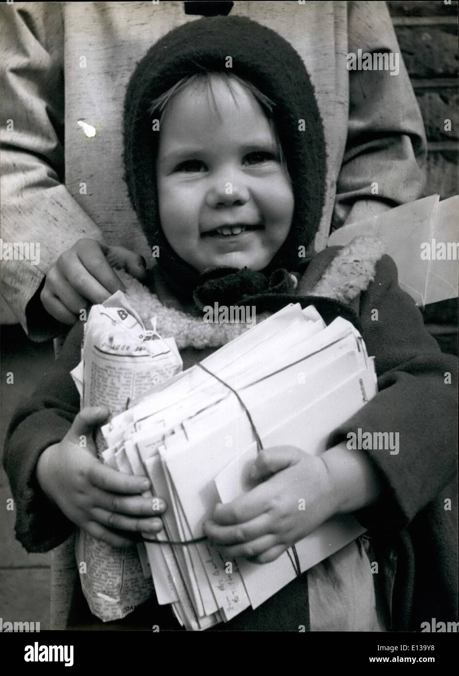 Feb. 29, 2012 - Her farthing bundle makes Christmastime smile Christine Boyce smiles happily ac she grasps her. Stock Photo