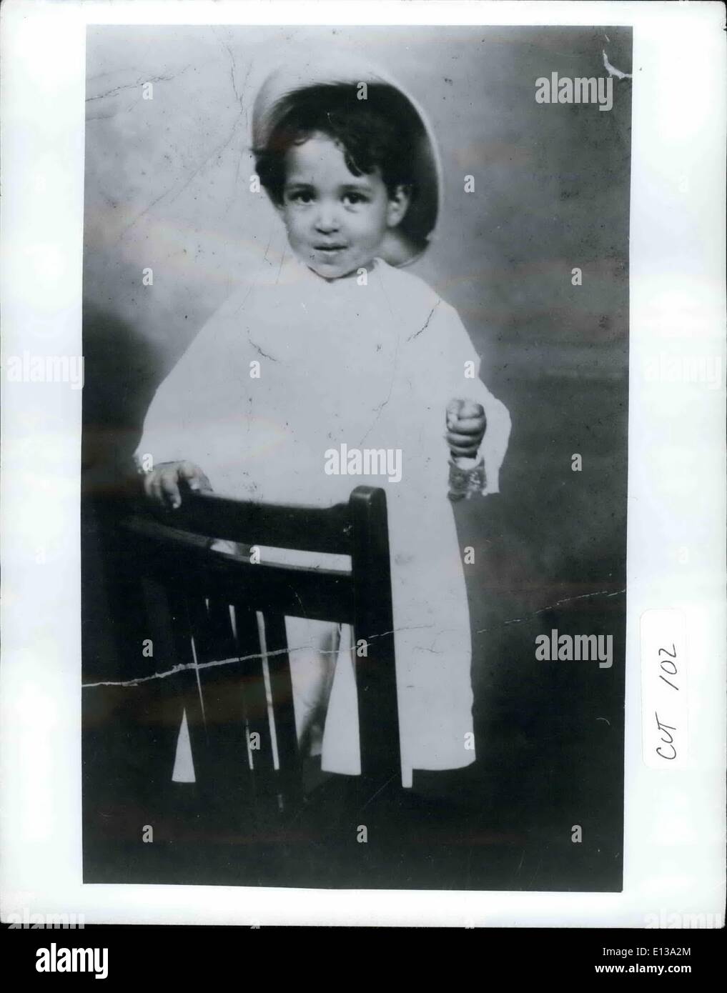 Feb. 29, 2012 - Fifty seven years ago a two year old American ethnic boy shown in Photo stared apprehensively into the big eye Stock Photo