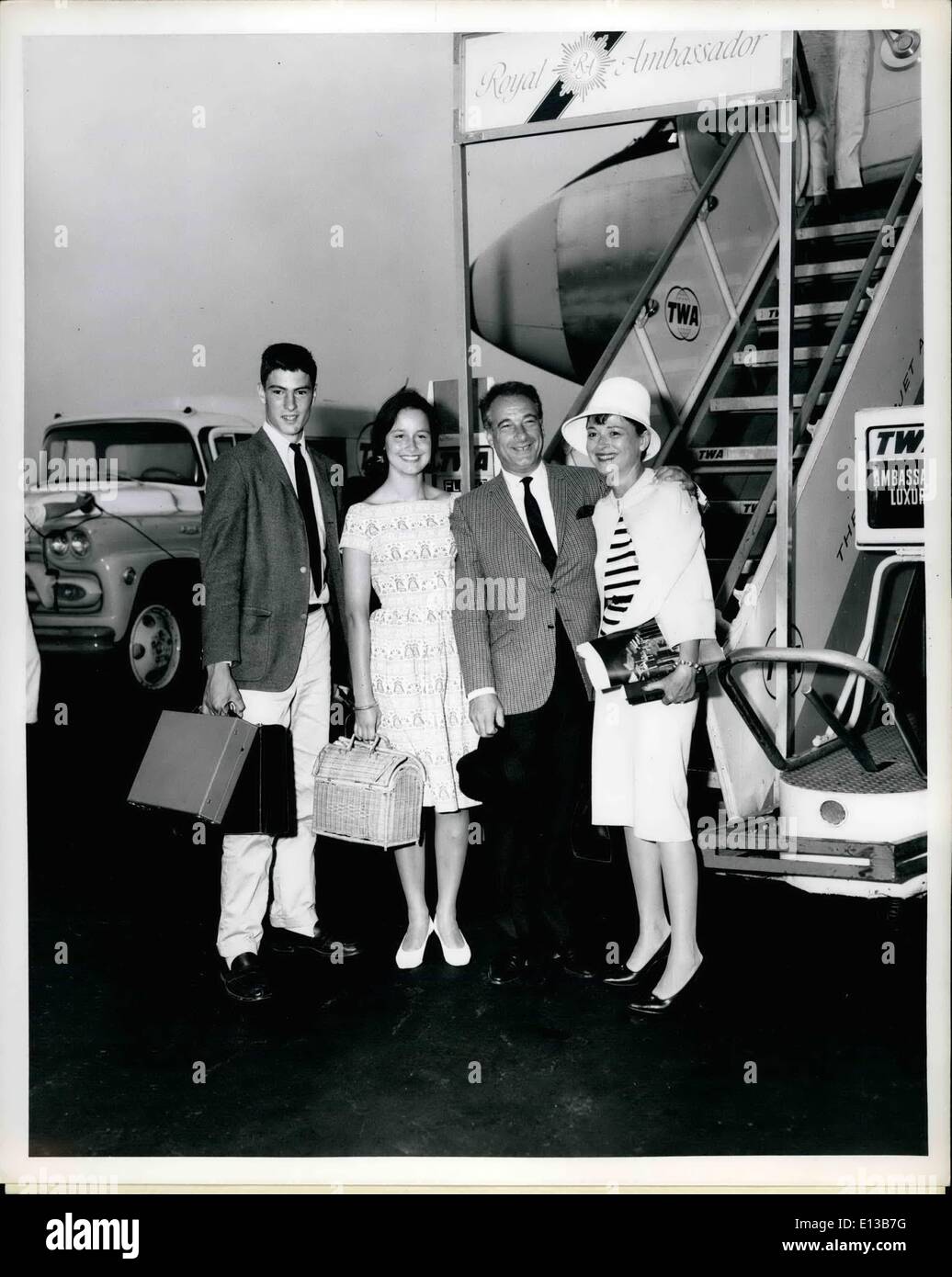 Feb. 29, 2012 - FOR IMMEDIATE RELEASE NEW YORK INTERNATIONAL AIRPORT,JULY 2nd Victor Borge, the hilariously funny pianist, is shown with Mrs. Burge and their two children Ron (left),15 and Sauna (2nd frsm left),16, about to board a TWA SuperJet for London. Burge will appear in a London theater and then will take his family for a 6 weeka. pleasure and professional jaunt around Europe. Stock Photo