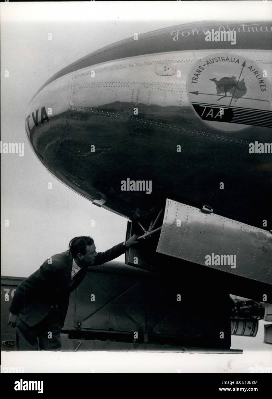 Feb. 29, 2012 - PRODUCING THE VICKERS VISCONT. Vickers Armstrong test pilot Bill Cairns studies the under carriage of one of.the first of five Trans-Australian Airlines Viscounts during final tests before he takes it up for flight tests at Hurn, Hampshire Stock Photo