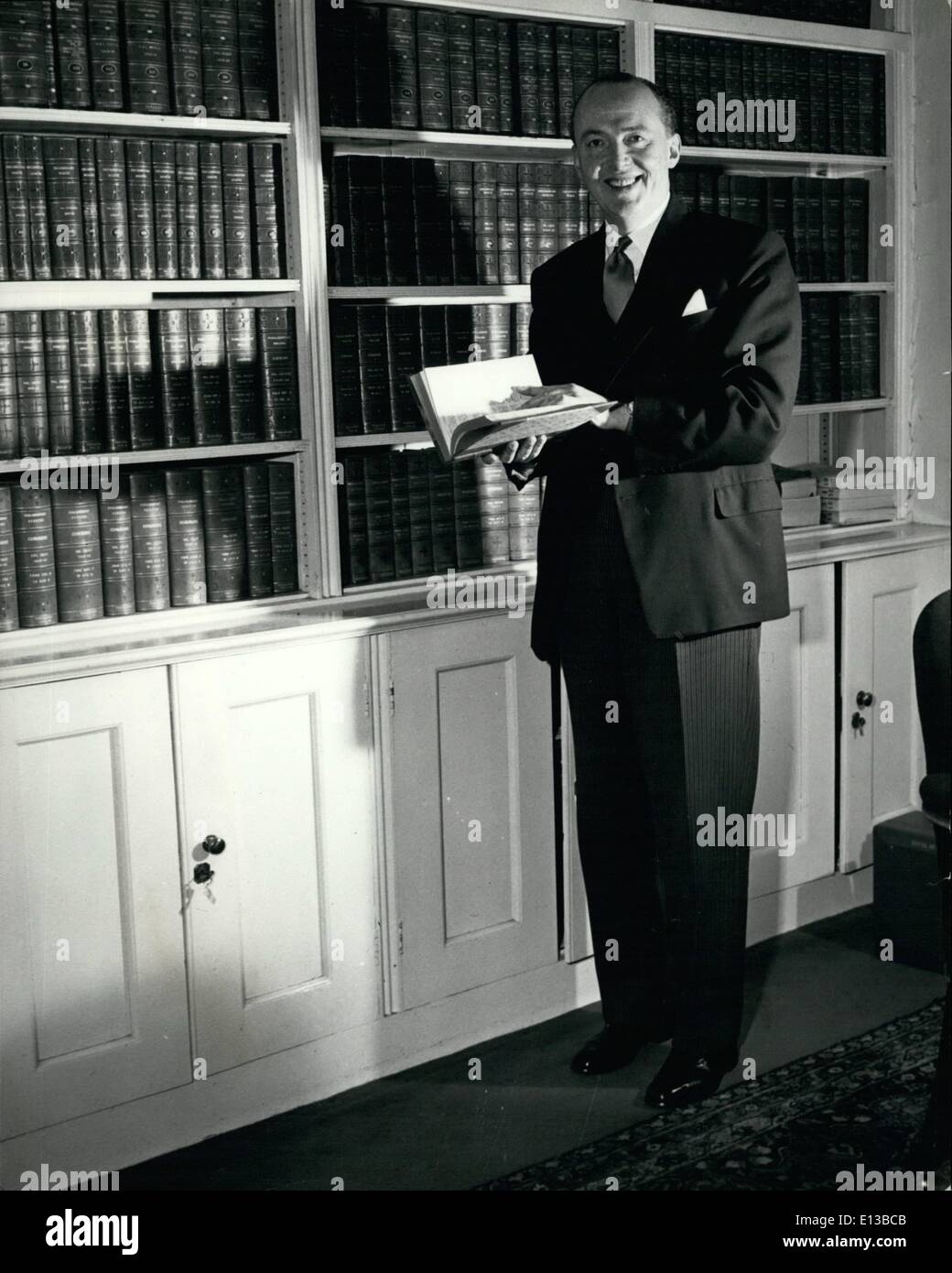 Feb. 29, 2012 - Dr. Peter Thorneycroft looks happy as he browses among the books at Nol 11, Downing Street. We hope the tax payer will smile as broadly after Tuesday. Stock Photo