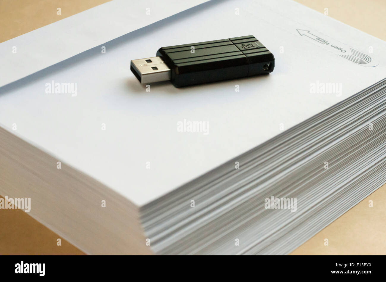 Stack envelopes and flash drive Stock Photo Alamy