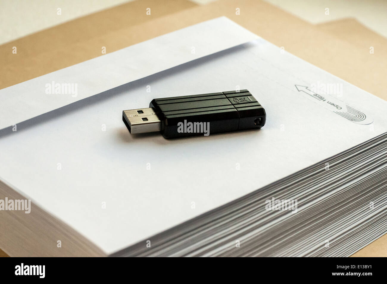 Stack envelopes and flash drive Stock Photo Alamy