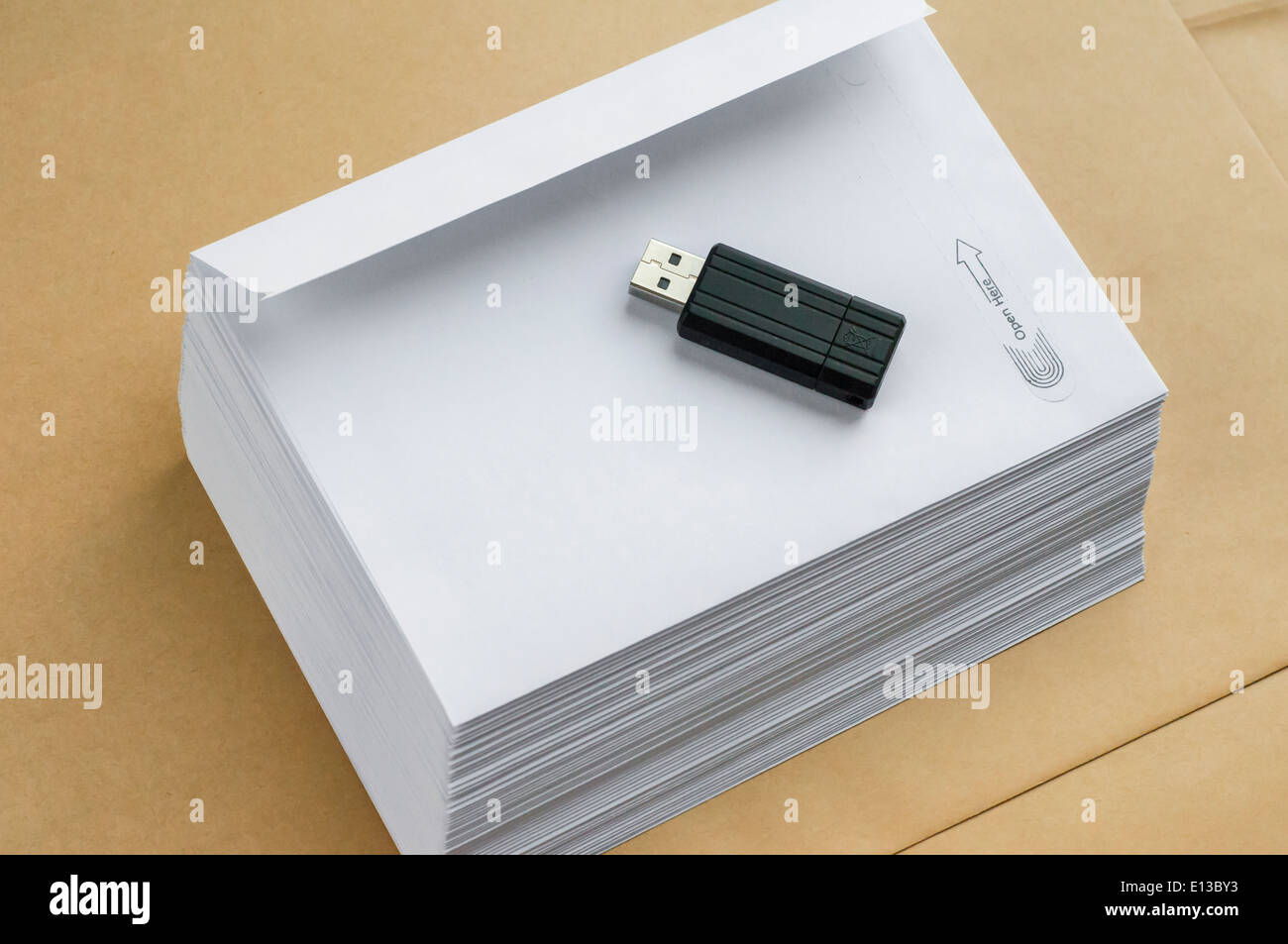 Stack envelopes and flash drive Stock Photo Alamy