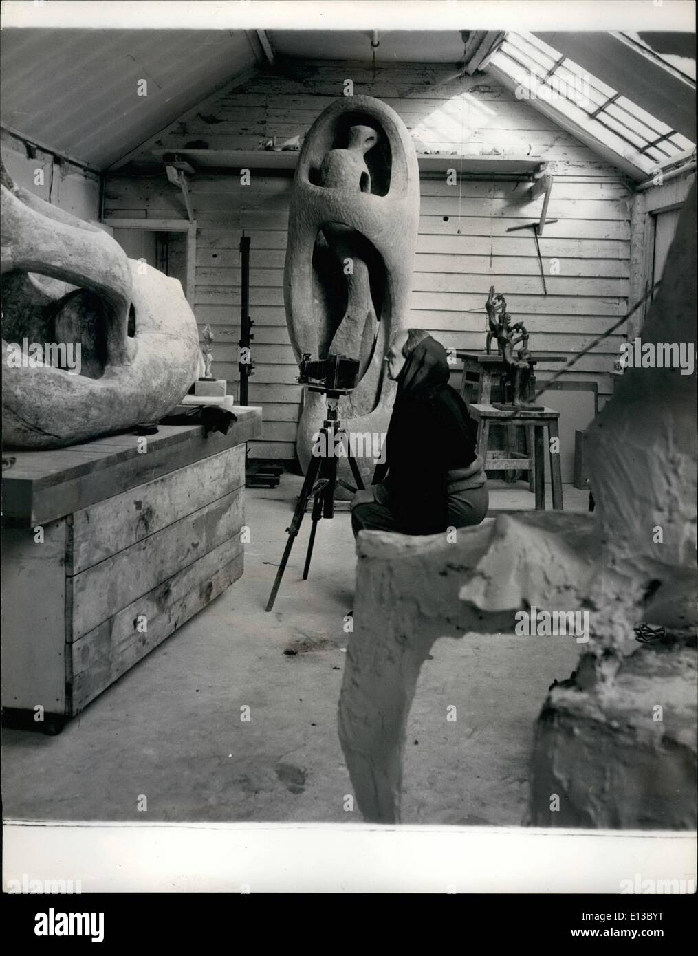 Feb. 29, 2012 - Sculptor Henry Moore is caught snapping: Our photographer went to see famous sculptor, Henry Moore at his studio at Perry Green, near Bishops Stortford to photograph some of his latest works. but when he got there he found the famous man was doing just that himself. Henry Moore is a keen amateur photographer and he keeps a photographic record of all his works which he takes himself. It was not until he finally emerged for the last time from beneath the black cloth that he spotted the photographer who, in the meantime had been busy with his own camera as these pictures show Stock Photo