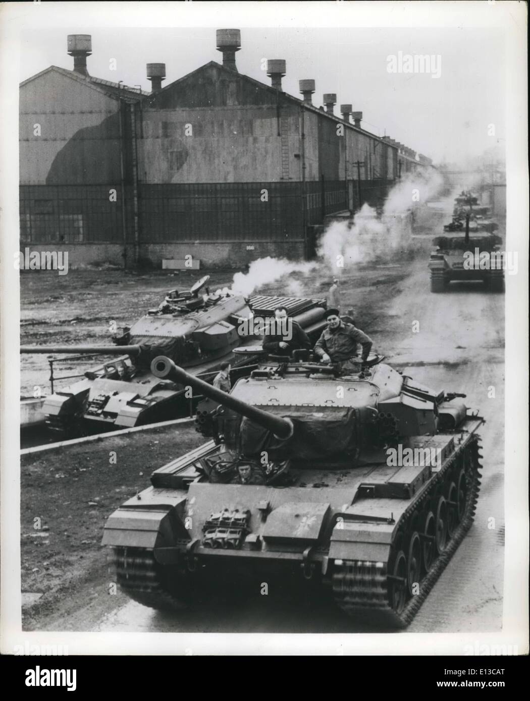 Feb. 29, 2012 - British Tank Crashes Through Korea Tests To U.S. Order 500 fifty-ton Centurion tanks, now standard throughout the British Army, have been bought by the United States under the Military Aid program, the first foreign tank ever to win a U.S. order. The Centurion won its fame with the British Commonwealth Division in Korea. ''Can beat all comers in mountain warfare'' and ''Worth untold gold to the infantry'' are two front-line reports on it. Picture Shows:- Centurion on a running test at a Royal Ordnance Factory near Leeds, England. Another (left) is about to begin a water test Stock Photo