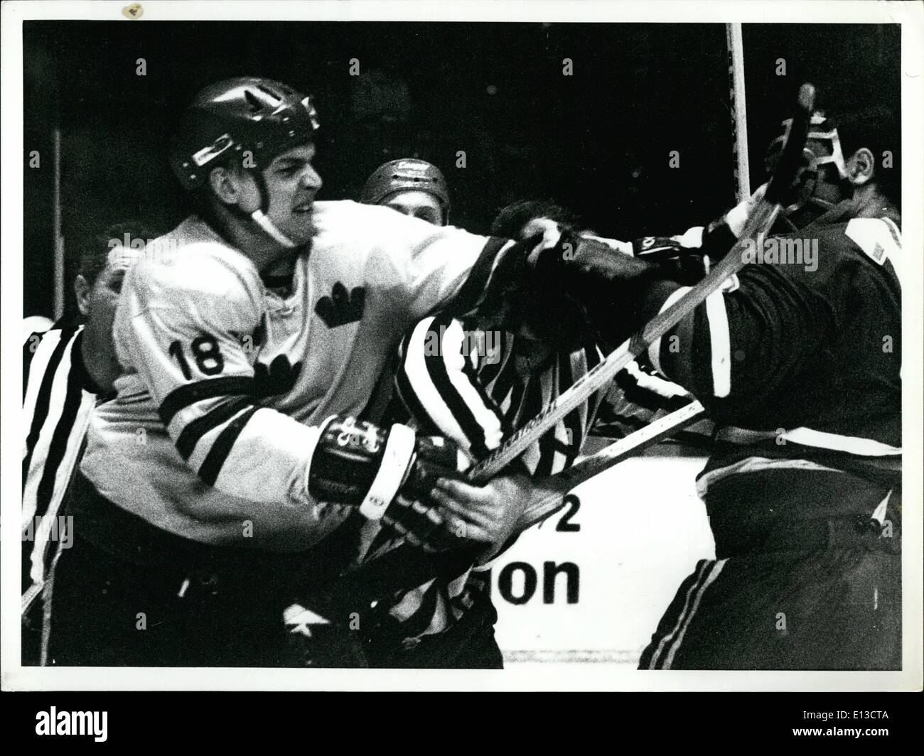 Mar. 02, 2012 - Ice Hockey world championship stockholm 1970 USSR Sweden: A close up picture of NR 18 Bjorn Palmqvist, the referee and Dzurilla (The CZECH Goalkeeper) from the fight. Stock Photo