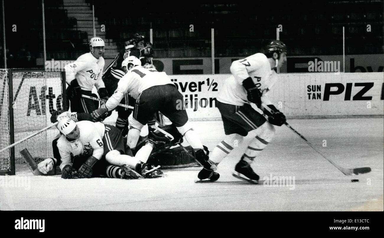 Mar. 02, 2012 - World Championship in Ice Hockey, Stockholm 1970, Finland-Poland result: 4-0 After the defeat against Soviet, the Finnish team today won the match against Poland and the Finnish trainer says that the Finnish team will be better now and that the Finnish center Juhani Tamminen shall fly between Abo and Stockholm to every match, since he had to study in Abo. Picture showing: The right forward nr 17 Tadeusz Obloj playing alone with puck while a lot of players is fighting in front of the Finnish goal. Stock Photo