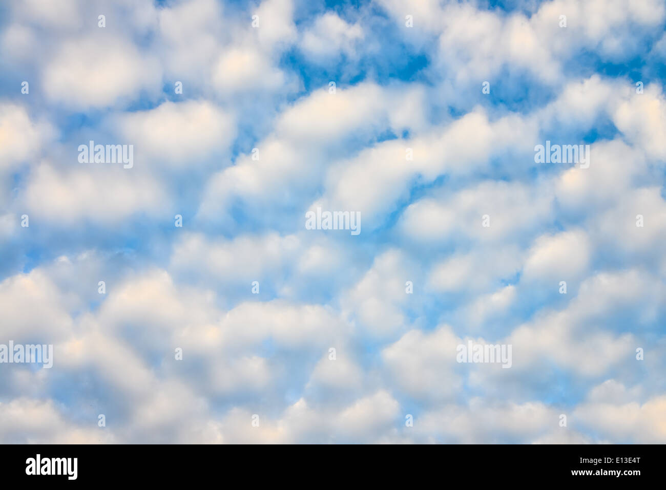 The blue sky and white fluffy clouds Stock Photo - Alamy