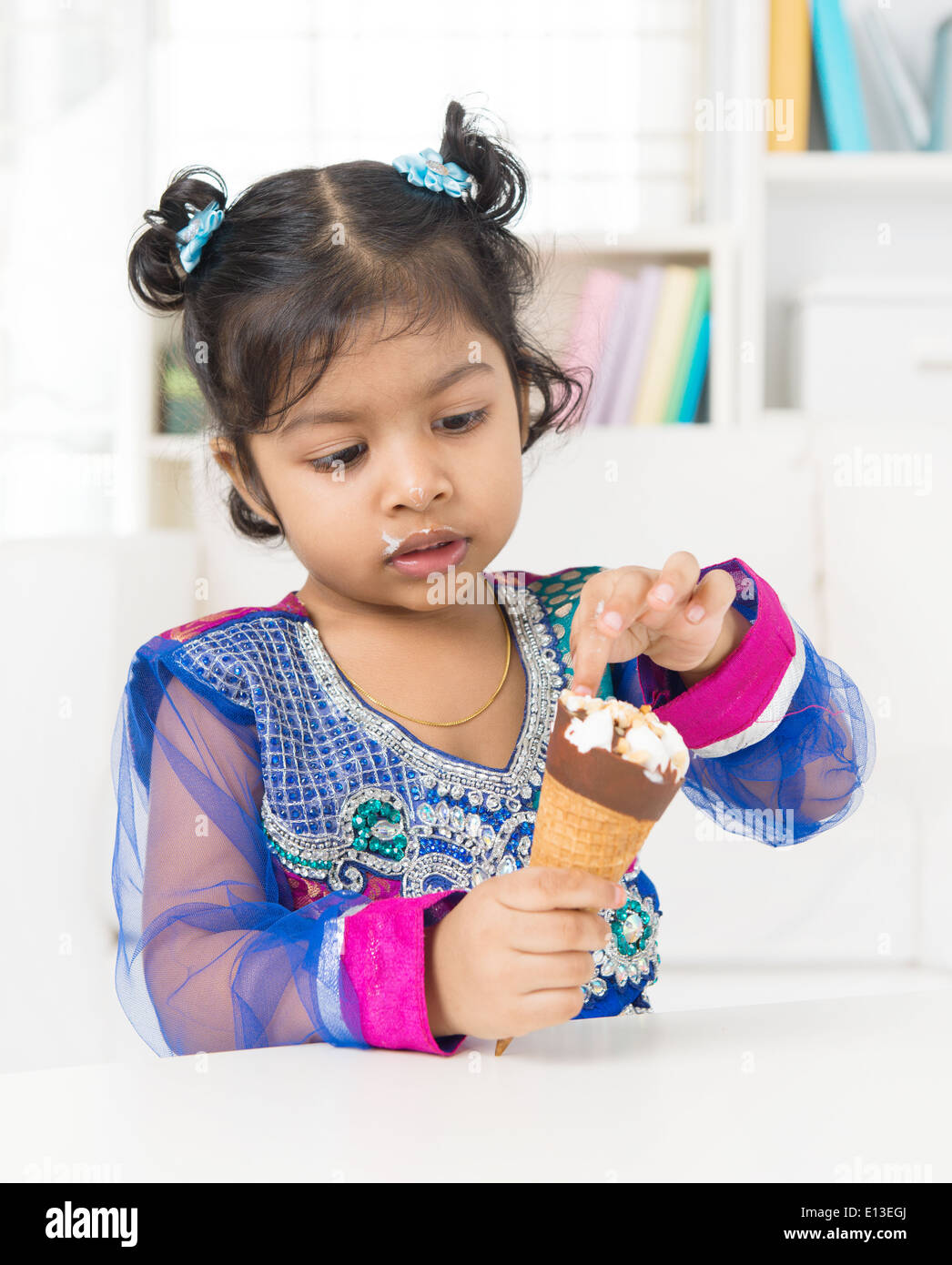Indian girl eating ice cream hires stock photography and images Alamy
