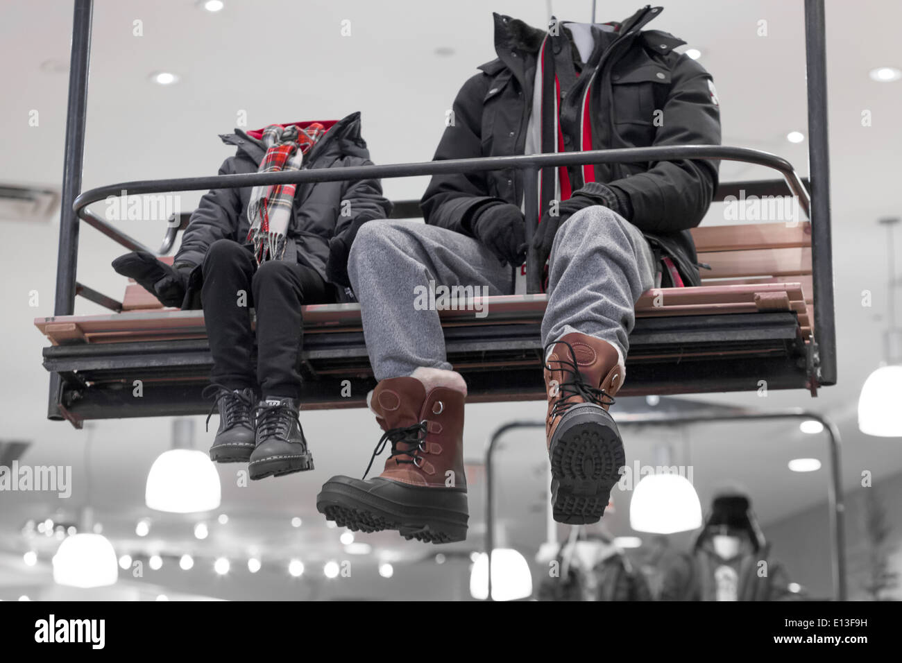 Mannequins wearing boots and jackets in a store Stock Photo Alamy