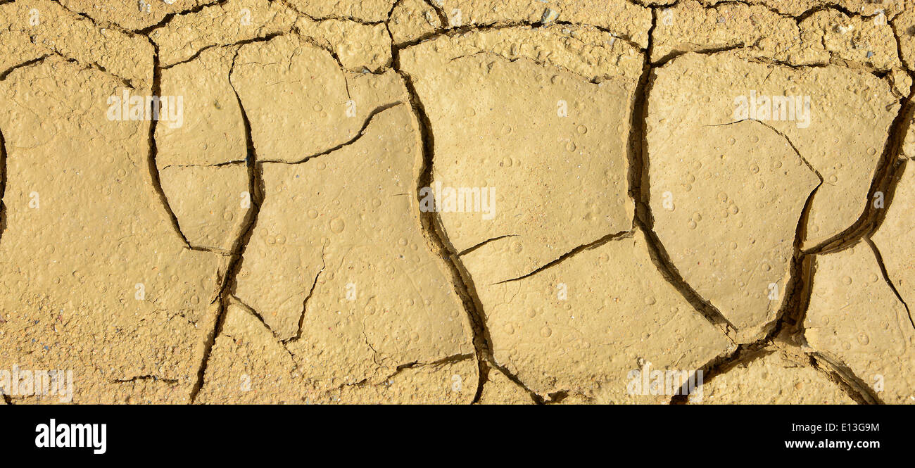 Close-up of dry soil in arid climate. Cracked ground in a desert. Stock Photo