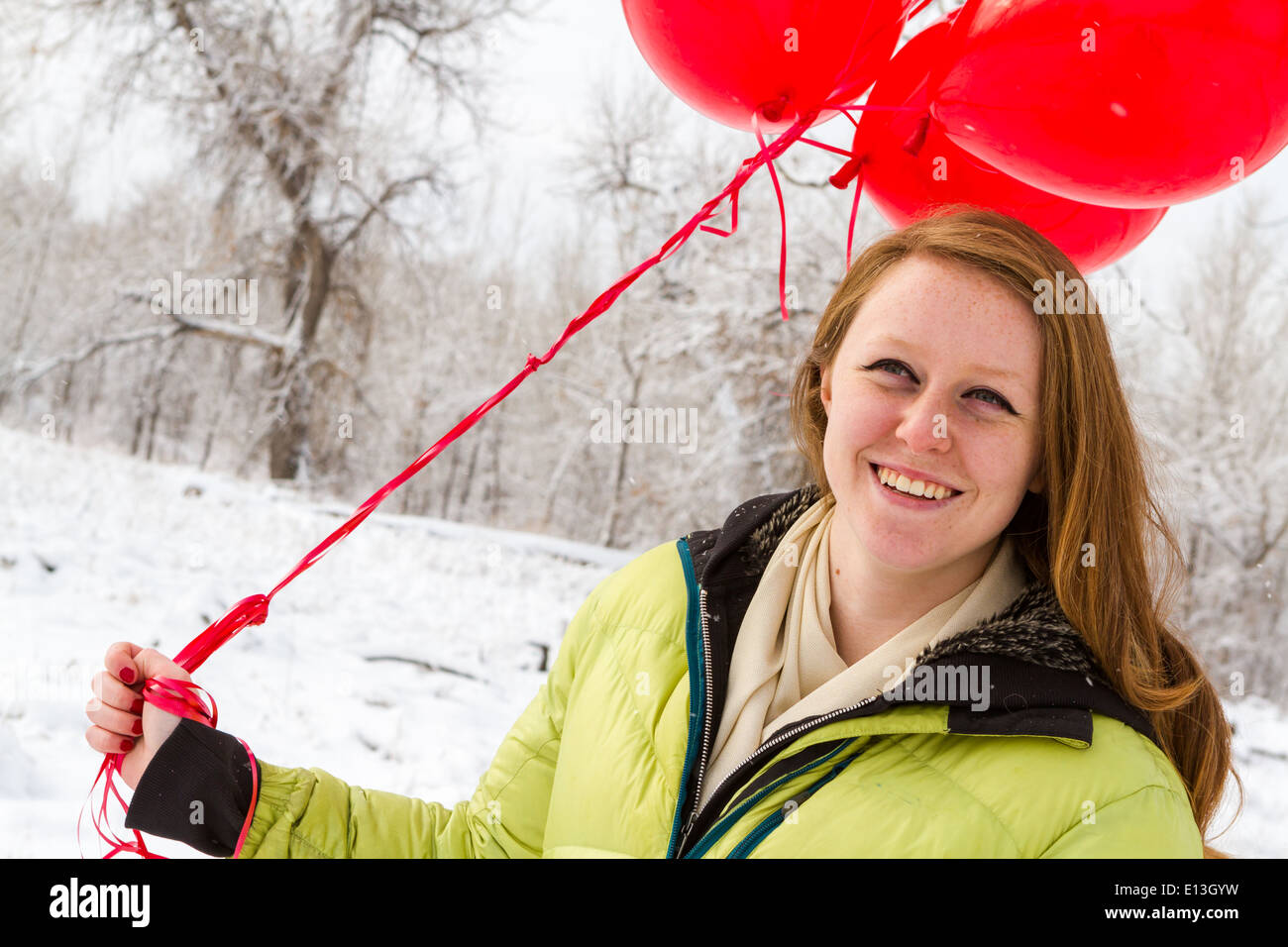 Teenager girl with red balloons walking in the park Stock Photo - Alamy