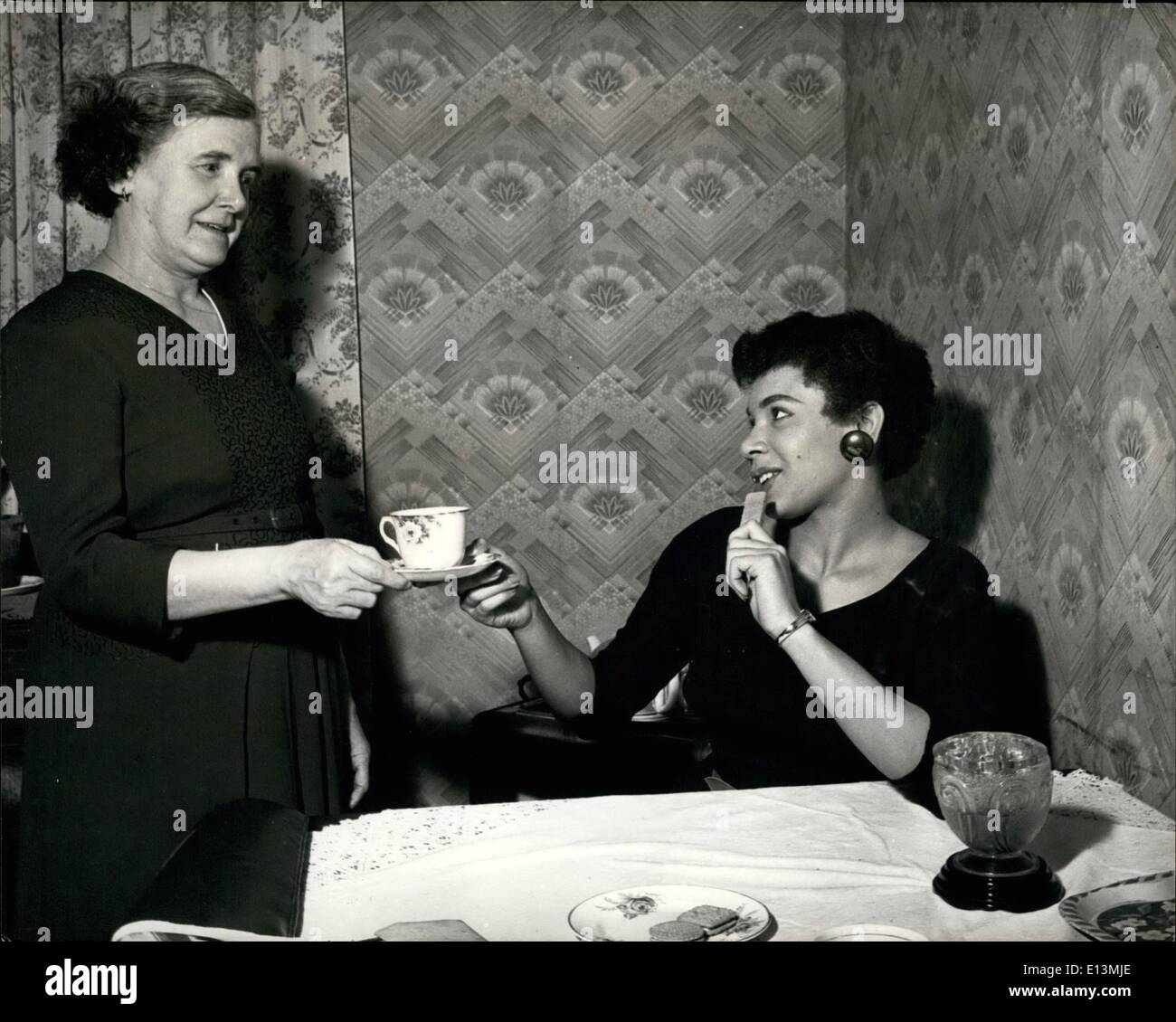 Mar. 02, 2012 - SHIRLEY BASSEY ENJOYS A HOMELY CUP OF TEA. Coloured Blue singer, Shirley Bassey, enjoys being at home and having tea with her mother. THE GIRL FROM CARDIFF'S ''TIGER BAY'' FOR LAS VEGAS AND HOLLYWOOD SHIRLEY BASSEY ON THE SKYWAY TO SUCCESS IN THE STATES. Britain's recently risen coloured 18-year-old blues singer from the slum dock area of Cardiff (Wales) is soon to star in Las Vegas. She leaves foe America in mid-january and after starring in Las Vegas will go on for film tests in Hollywood Stock Photo