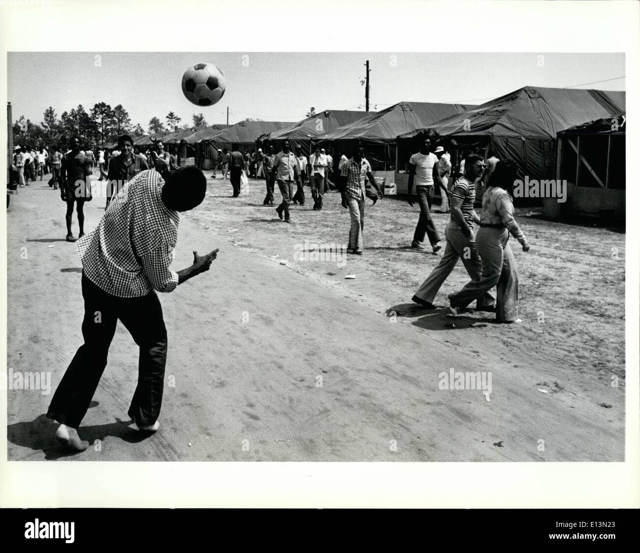 Mar. 02, 2012 - Cuban refugee pass the time by playing soccer in the tent city at Fort Waton Beach fairgrounds/ Eglin Air base. Stock Photo