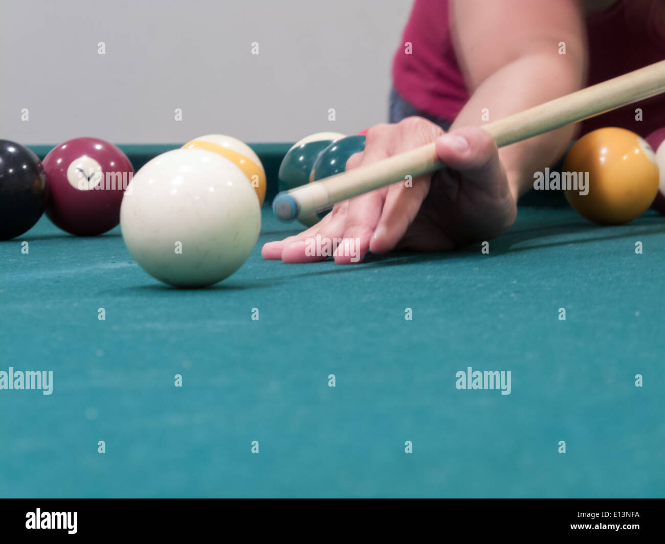 Woman ready to hit white ball Stock Photo Alamy