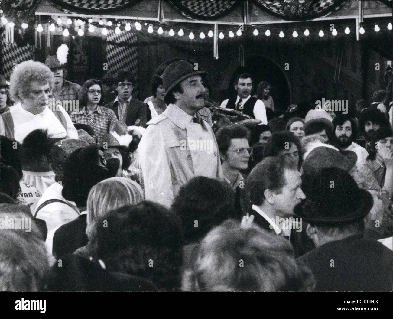 Mar. 22, 2012 - Actor Peter Sellers films in Munich: The first scens of a new, thrilling adventure of Inspector Clouseau, played by British Actor Peter Sellers (picture, in centre) are presently made in Munich. In a beer stronghold of the Bavarian capitol, a samll ''Oktoberfest'' has been initiated or the feature called the Pink Panther strikes again'' (costs 12 millions of D-Marks). Directed by Blake Edwards, the popular comedian plays again the role of the very eager but rather clumsy detective with moustache and the inevitable trenchcoat Stock Photo