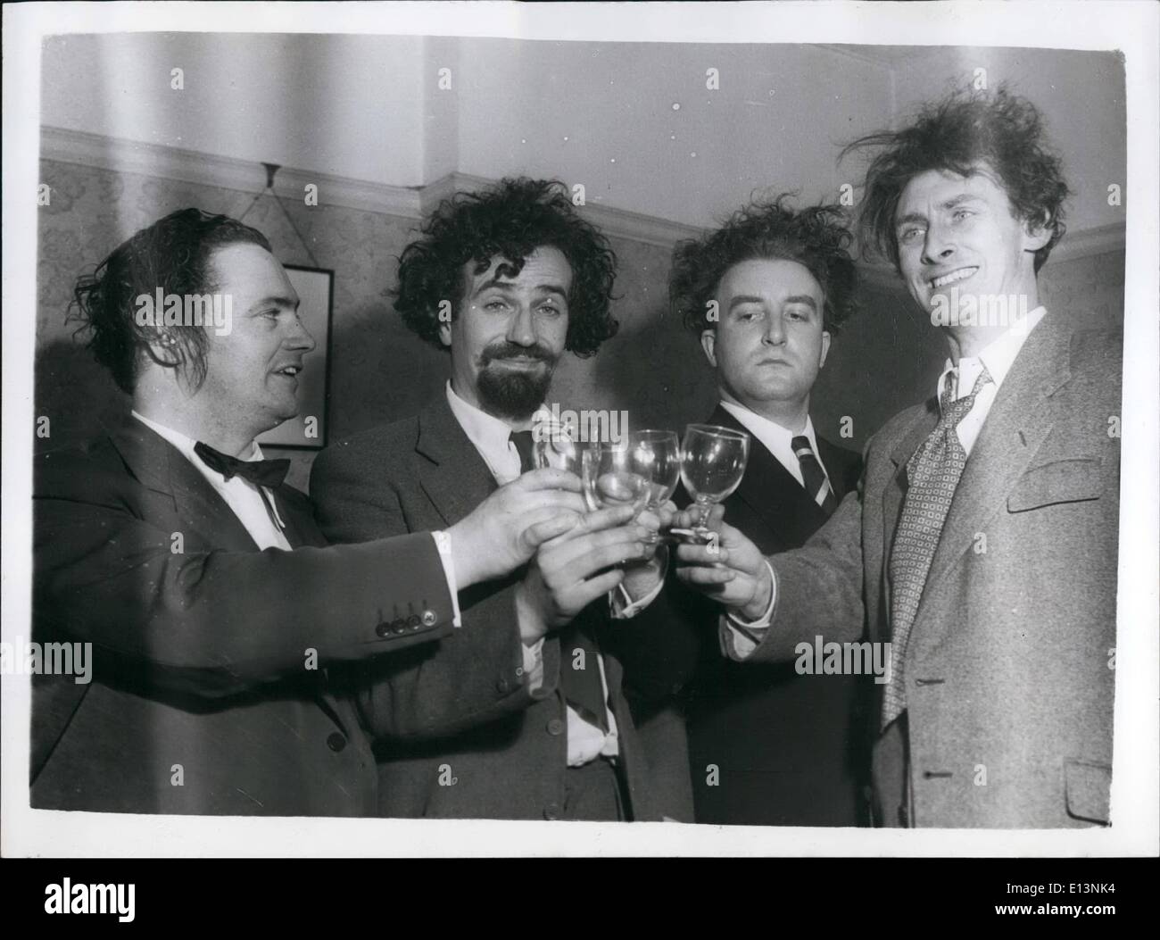 Mar. 22, 2012 - Here's to even crazier Goon Shows. The four Goons toast each other at the party they held to celebrate the first broadcast of the new Crazy People programme. (L to R) Harry Secombe; Michael Bentine; Peter Sellers and Spike Milligan. Stock Photo