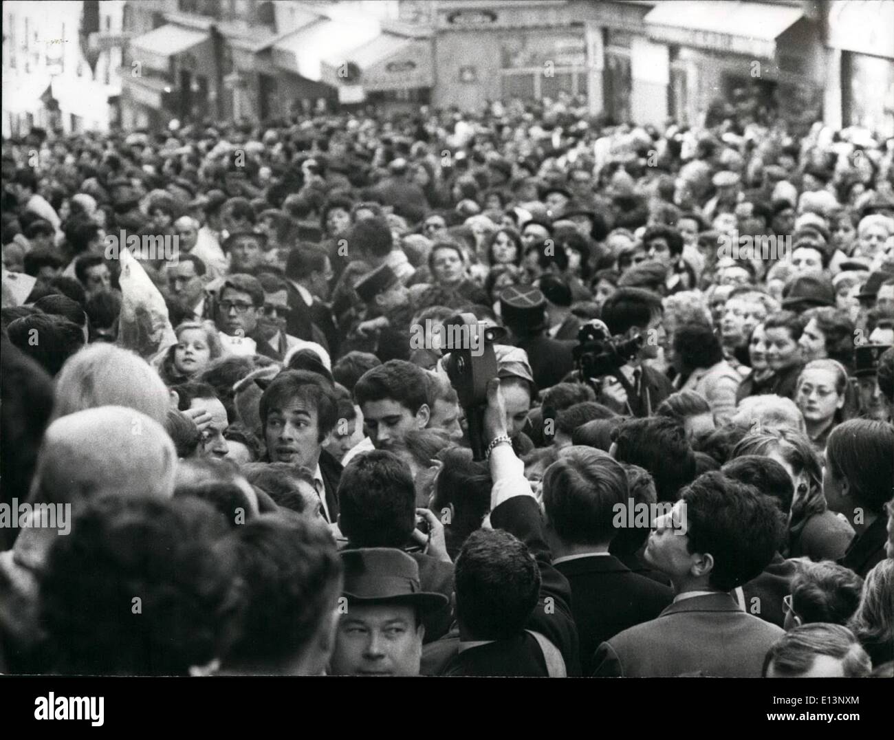 Mar. 22, 2012 - Edith Piaf memorial tablet unveiled; A memorial tablet over the house where Edith play was born in December 1915 was unveiled by Mauriche Chevallier in Belleville (Paris) yesterday. Photo Shows View of the huge crowd gathered to watch the unveiling of the tablet. Left foreground can be seen Edith Palfs young husband Theo Sarapo. Stock Photo