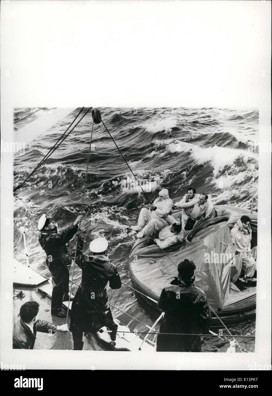 Mar. 22, 2012 - British Official Photograph-Admiralty. Issued by Central Office of Information.: Rough Seas Foil Atlantic Survival Tests.: Two groups of Naval Volunteers had a really rough time in the Atlantic over the week-end when the Ocean turned its vicious worst on five-day survival tests from the destroyer ''Carron''. The first group entered the water on Saturday - and had to be fished out ninety minutes later - when their raft was made unseaworthy by the battering seas Stock Photo