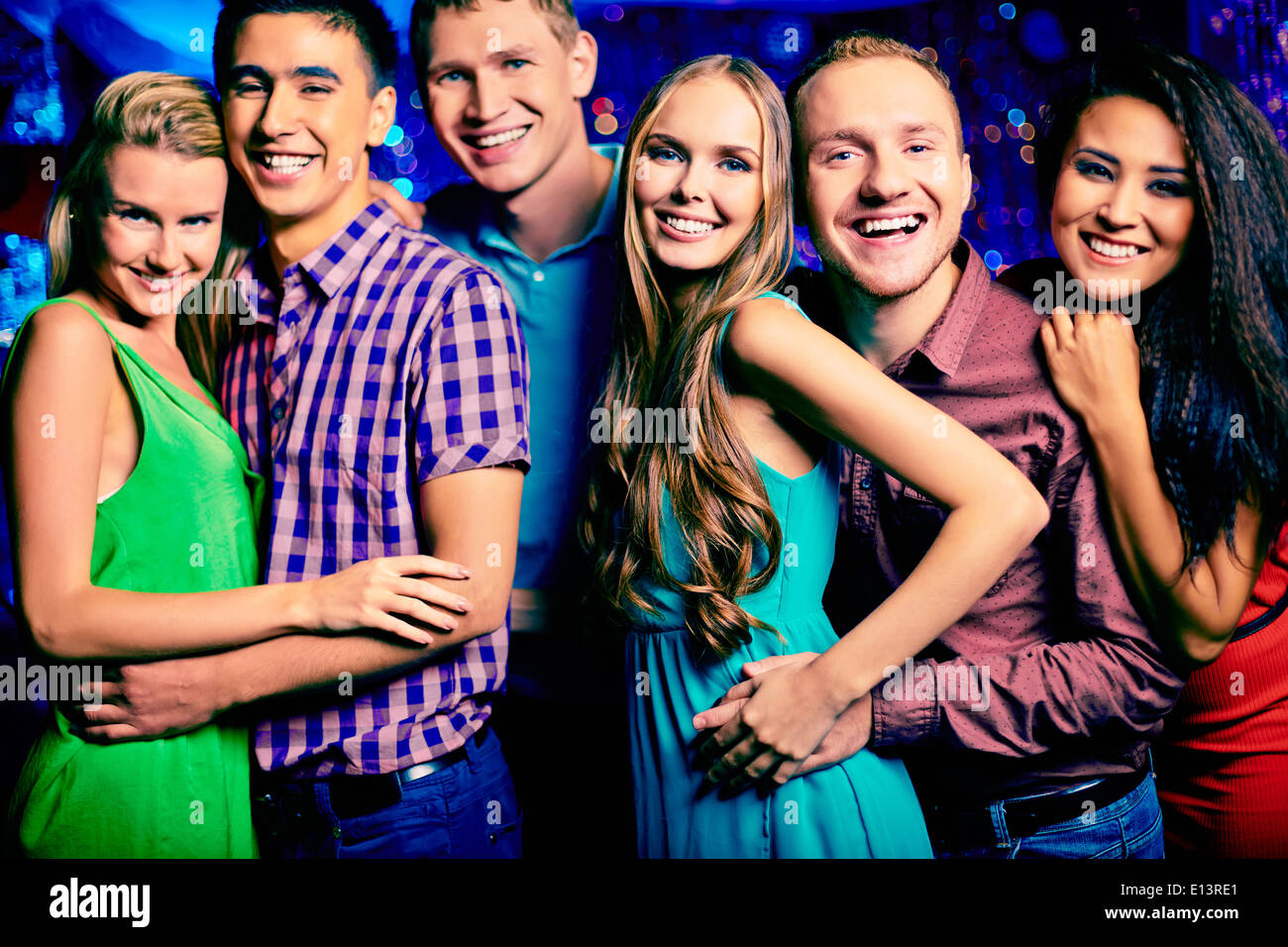 Portrait of happy friends looking at camera at party Stock Photo